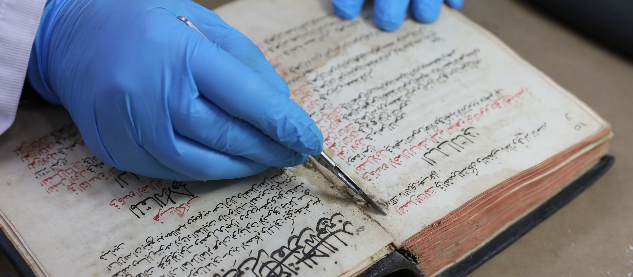 Dry-cleaning a Maronite manuscript at the USEK conservation centre, Kaslik — Aid to the Church in Need project, 2022.